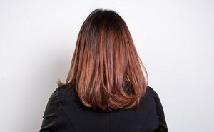 Woman with blue-toned red hair cut into a mid-length bob